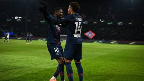 Ex-Bayern-Boss Karl-Heinz Rummenigge hat über die PSG-Stars Desiré Doué (r.) und Ousmane Dembélé gesprochen